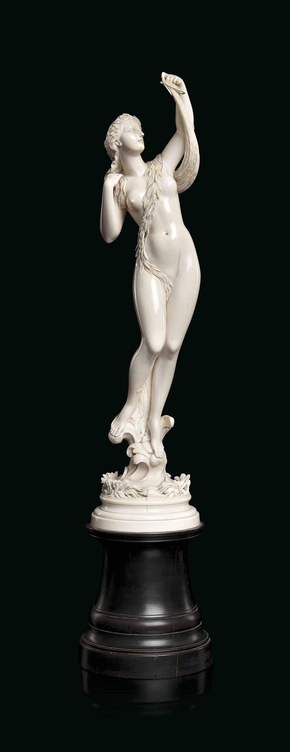 A FRENCH CARVED IVORY FIGURE OF A SEA NYMPH