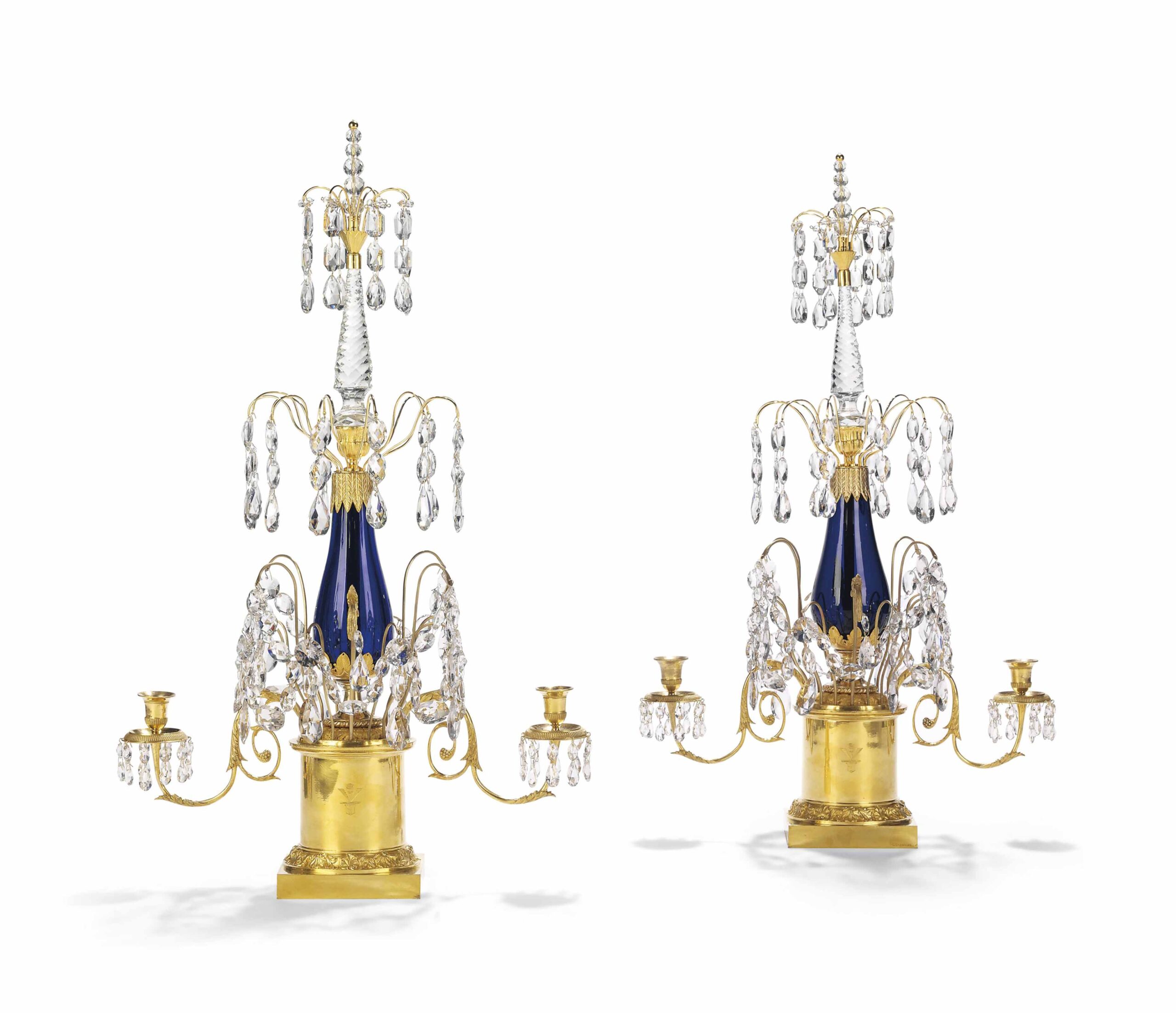 A PAIR OF BALTIC GILT-BRONZE REPOUSSE AND CUT-GLASS CANDELABRAS